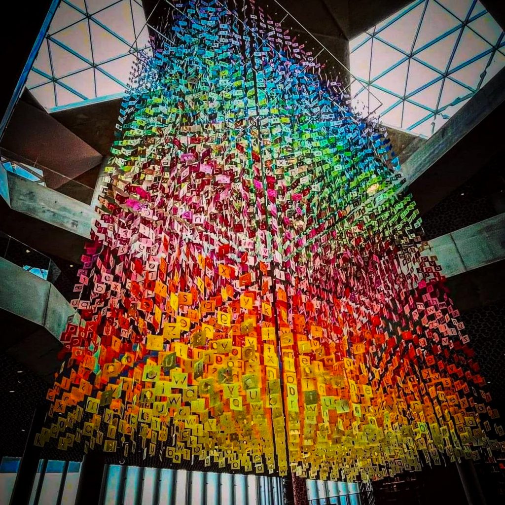 Rainbow colored chandelier artwork at The Deichman Library