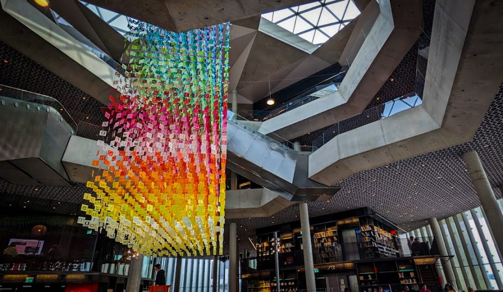 Rainbow colored chandelier artwork at The Deichman Library