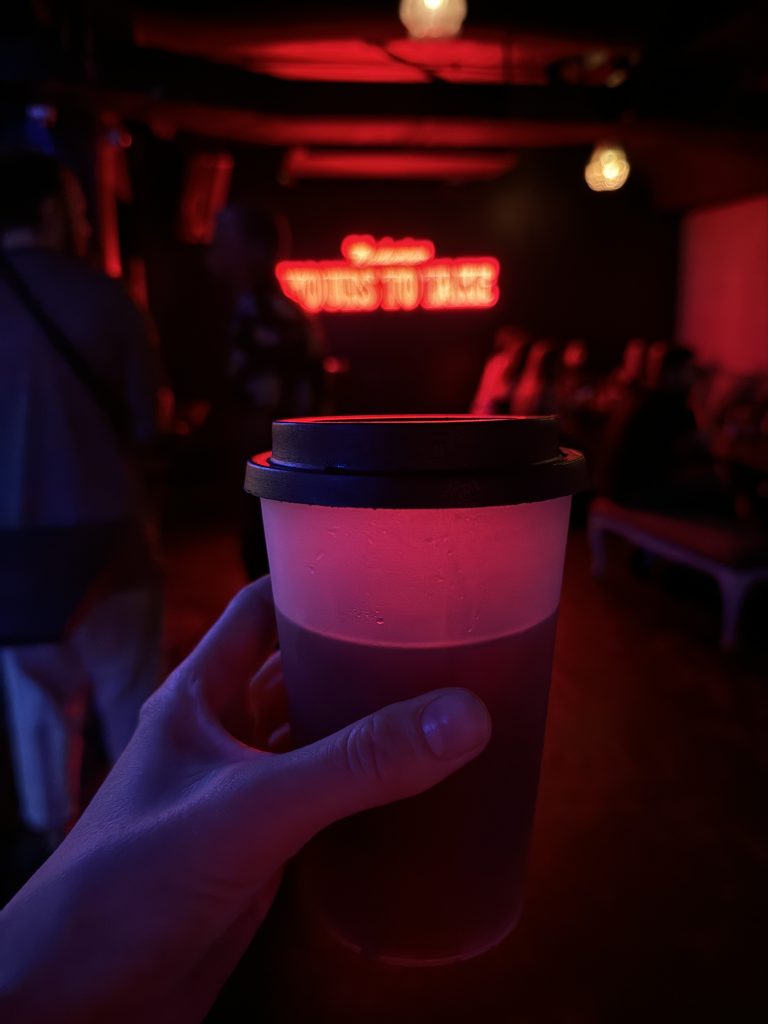 Candelaria nightclub cocktail served in a plastic coffee cup with lid