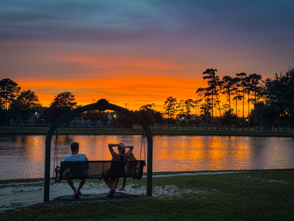 Park bench at sunset overlooking the lake at The Market Common in Myrtle Beach