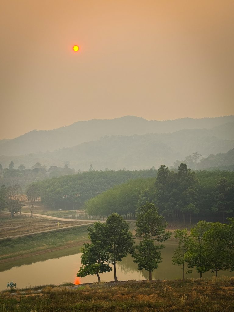 Hazy sky at sunrise during Northern Thailand burning season