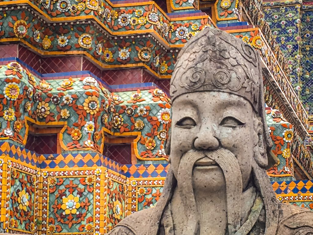 Stone face of a statue in front of Wat Arun