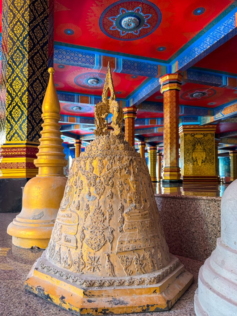Decorative golden temple bell inside Tiger Cave Temple in Krabi