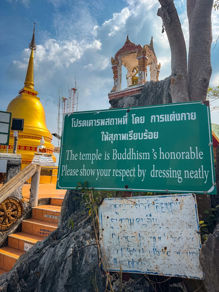 Dress code sign reminding visitors to dress respectfully at Tiger Cave Temple