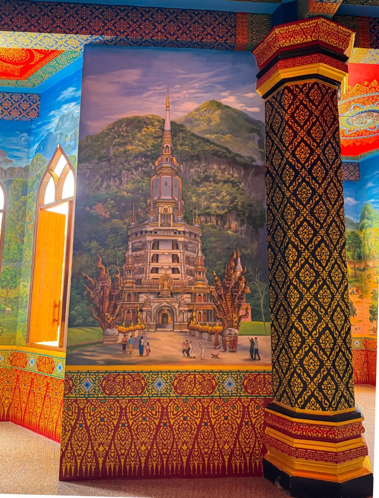 Mural of the Tiger Cave Temple pagoda inside the colorful temple hall