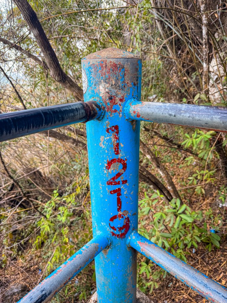 Step 1,219 marker on the staircase to the Tiger Cave Temple summit