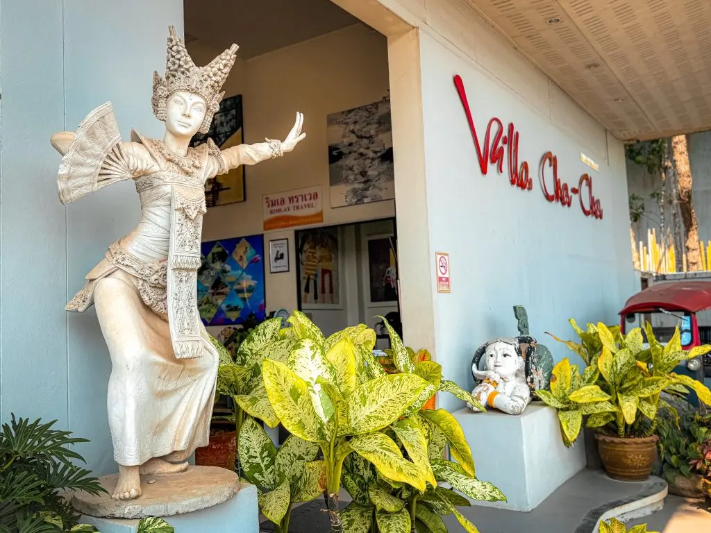 Thai dancer statue and tropical plants beside the entrance to Villa Cha-Cha Krabi.