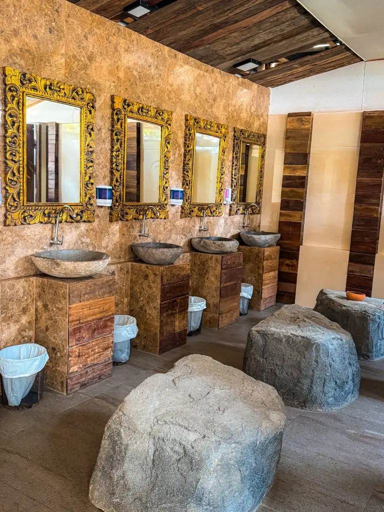 Stone sinks and ornate mirrors in the restroom at Villa Cha-Cha Krabi Beachfront Resort.