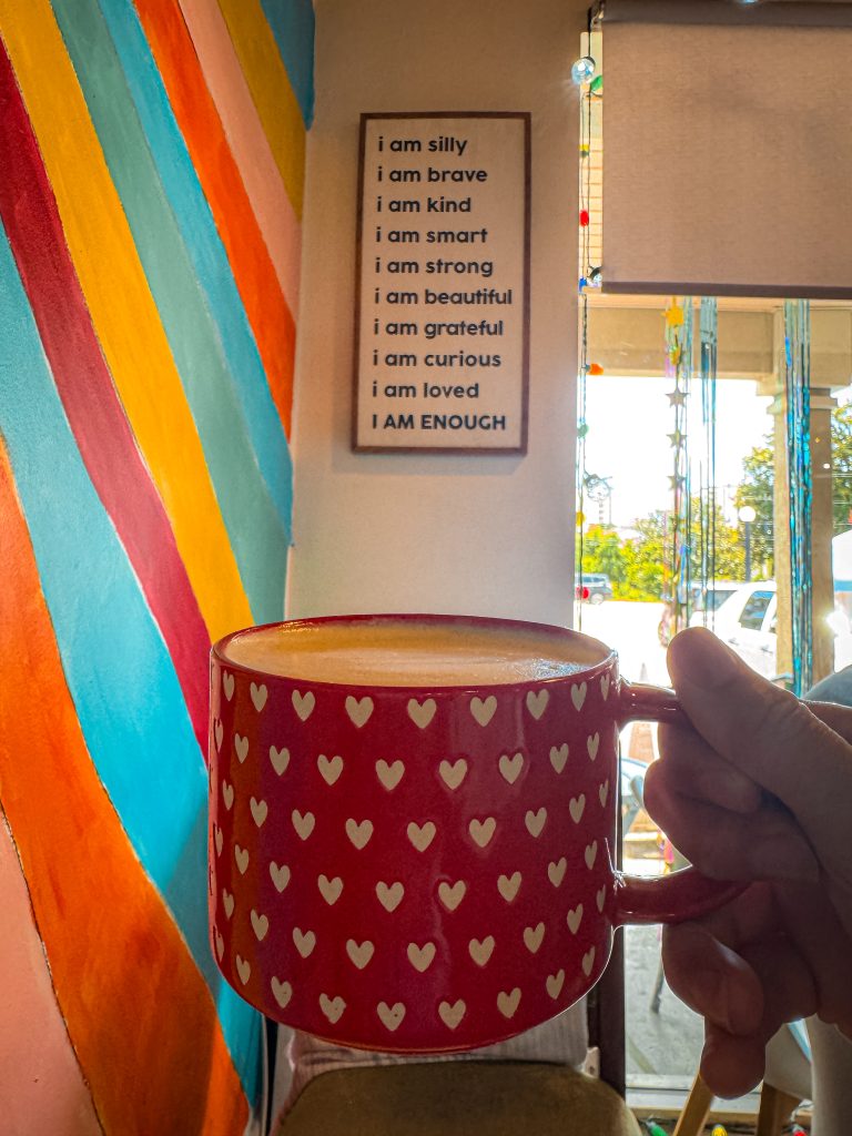 red mug with white hearts at coffee shop in Myrtle Beach