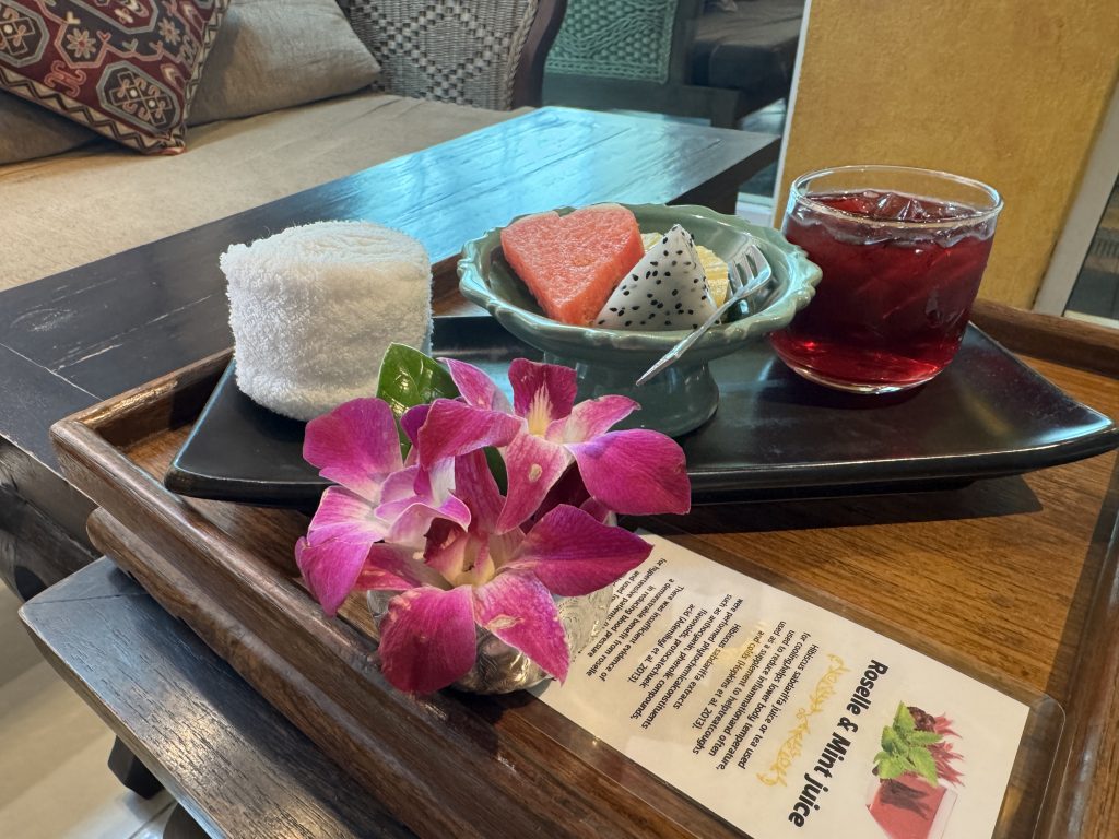 Flowers, fruit and tea with wet towel