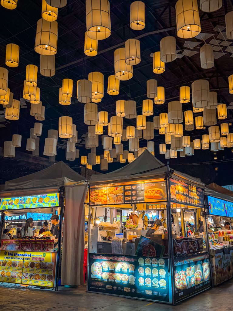 Lantern lit food stalls at a night market in Chiang Mai
