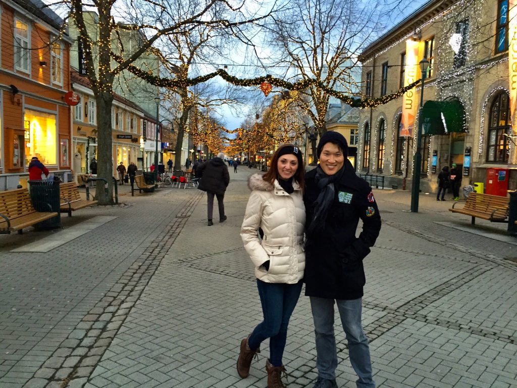 A couple under Christmas lights in downtown Trondheim