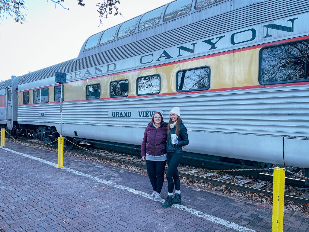 Two women in front of Grand Canyon train