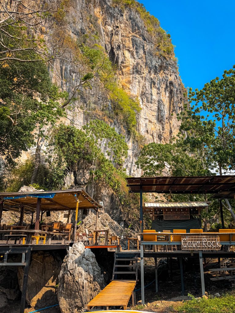 Cave Rock Bar built beneath a towering limestone cliff at Railay East in Thailand.