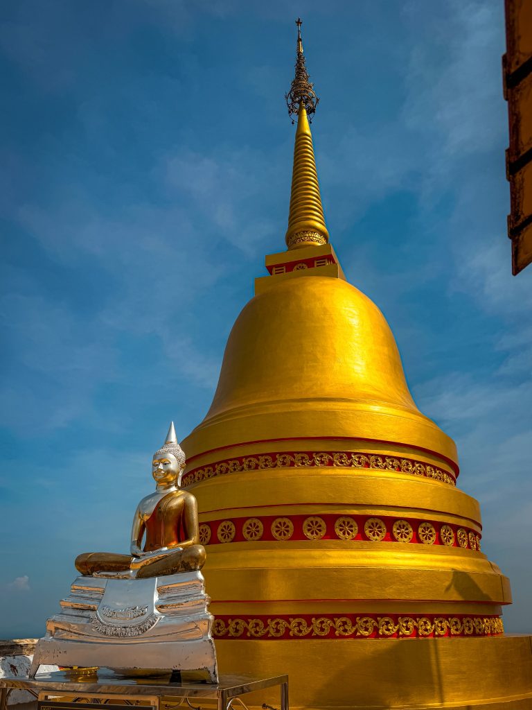 Golden stupa and silver Buddha statue at the Tiger Cave Temple summit