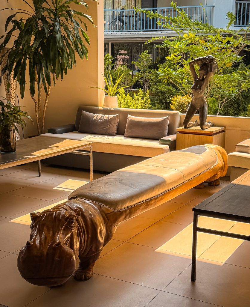 Hippo-shaped bench and lounge seating in the lobby at Villa Cha-Cha Krabi Beachfront Resort.
