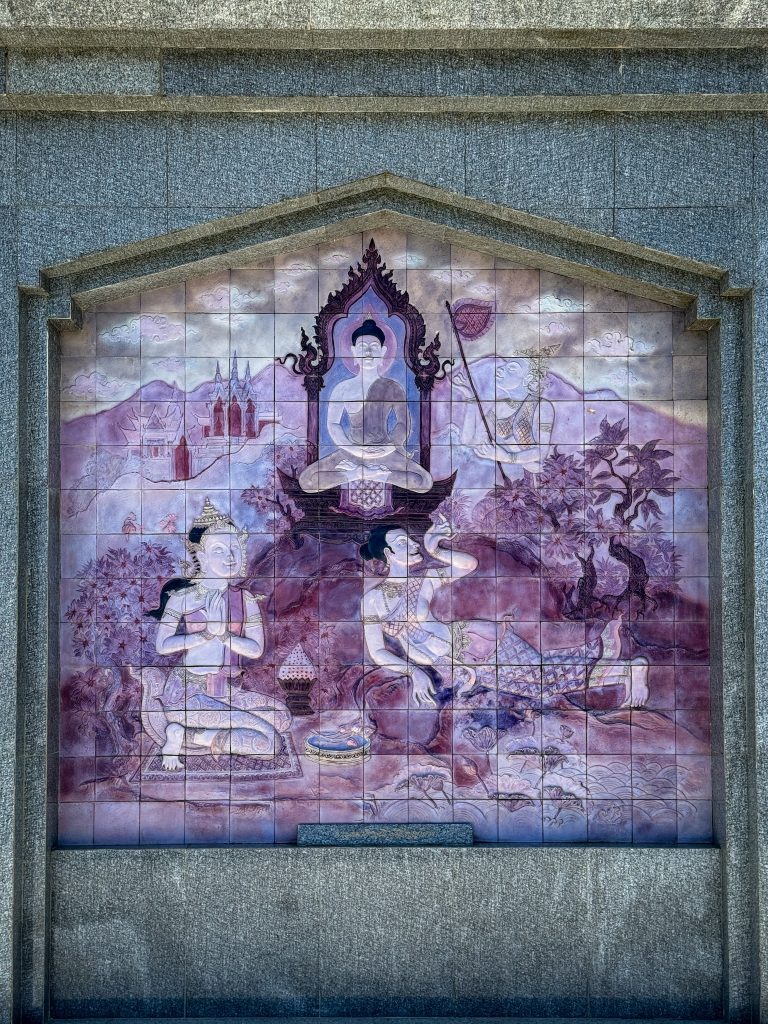 Purple decorative Buddhist tile mural displayed at the Royal Pagodas in Doi Inthanon National Park, Thailand.